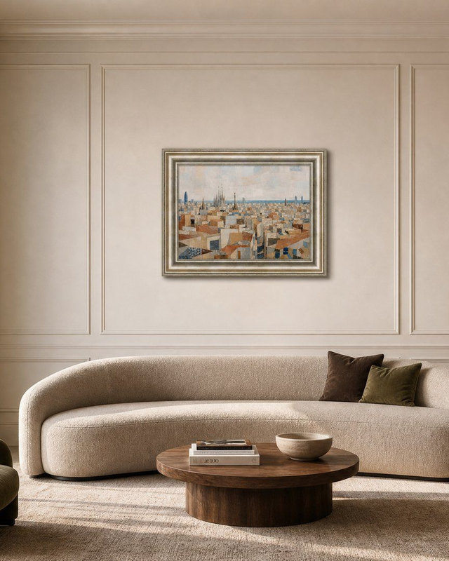 Framed Barcelona Rooftops print hung above a curved cream sofa in a Dubai living room, sized to two-thirds of the sofa width