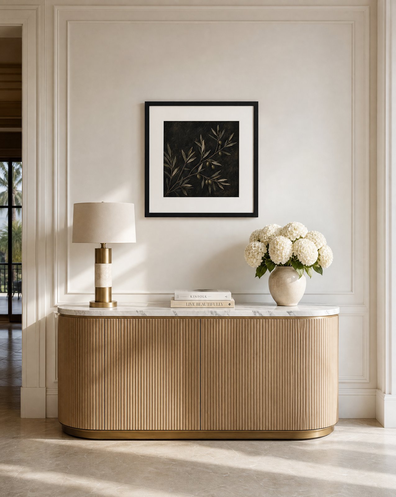 Olive Branch Study in a black frame above a fluted oak console with white hydrangeas