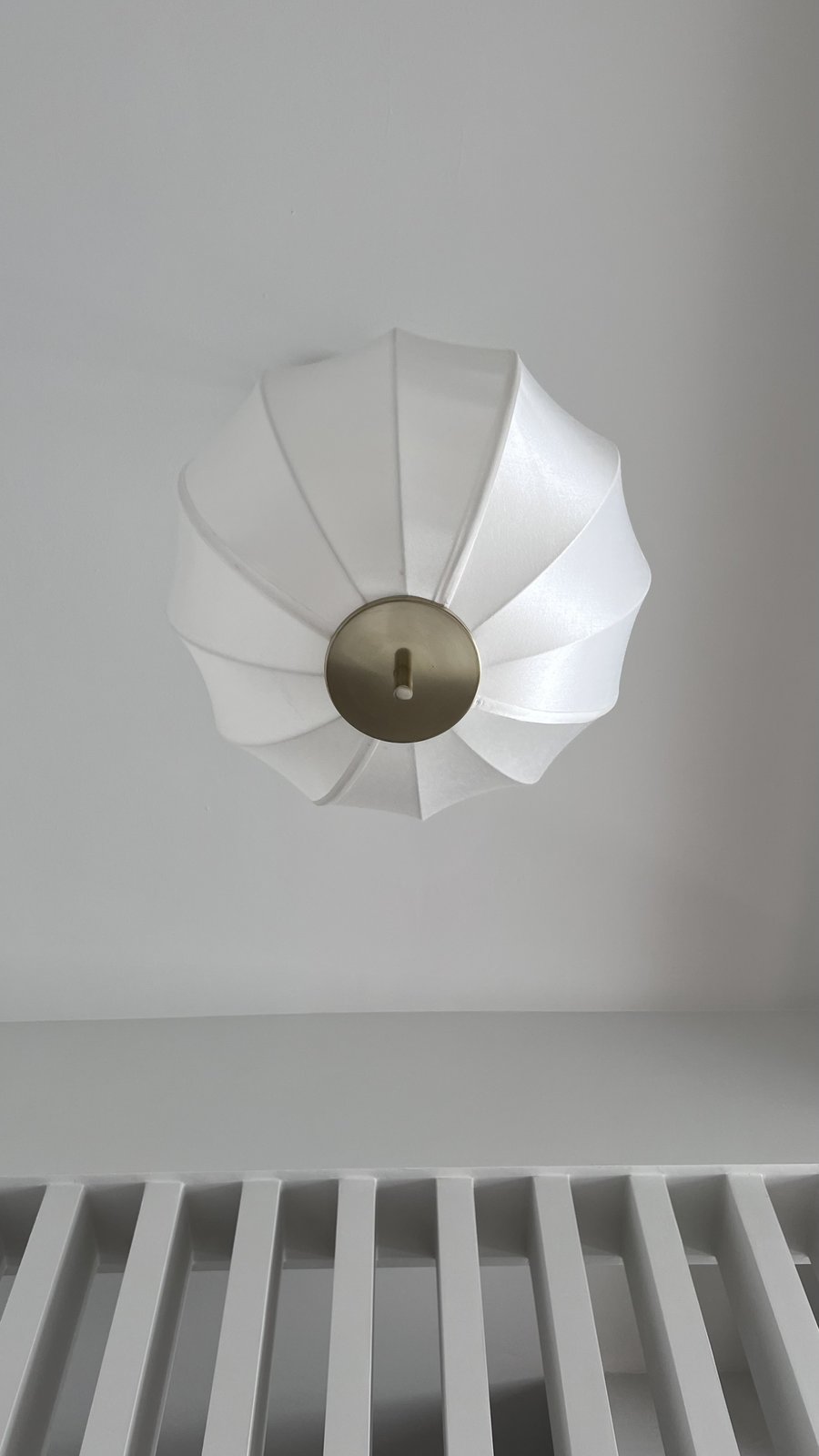 A pendant light fixture held in place and photographed as a test, Studio Sakaia, Dubai