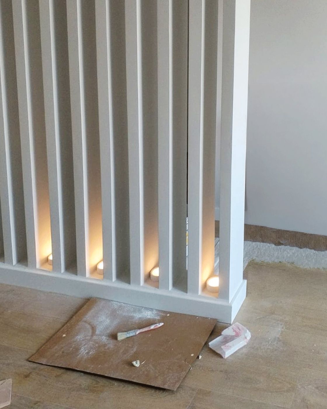 The clad and painted slats with tealight candles glowing between them, Studio Sakaia, Dubai