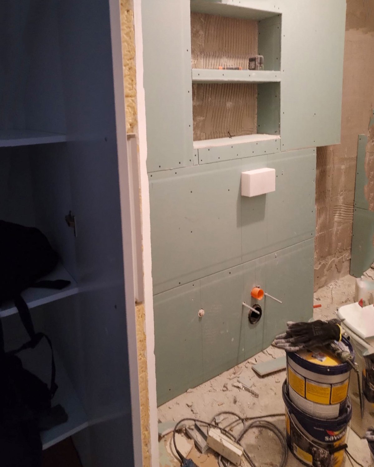 The niche formed in the boarded wall with the services roughed in, before the waterproofing closes it, Studio Sakaia