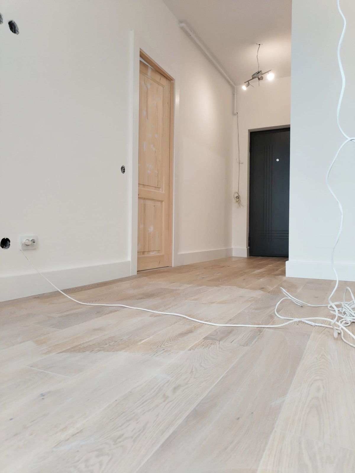 The floor laid but the room still mid-works, wired and dusty, Studio Sakaia, Dubai
