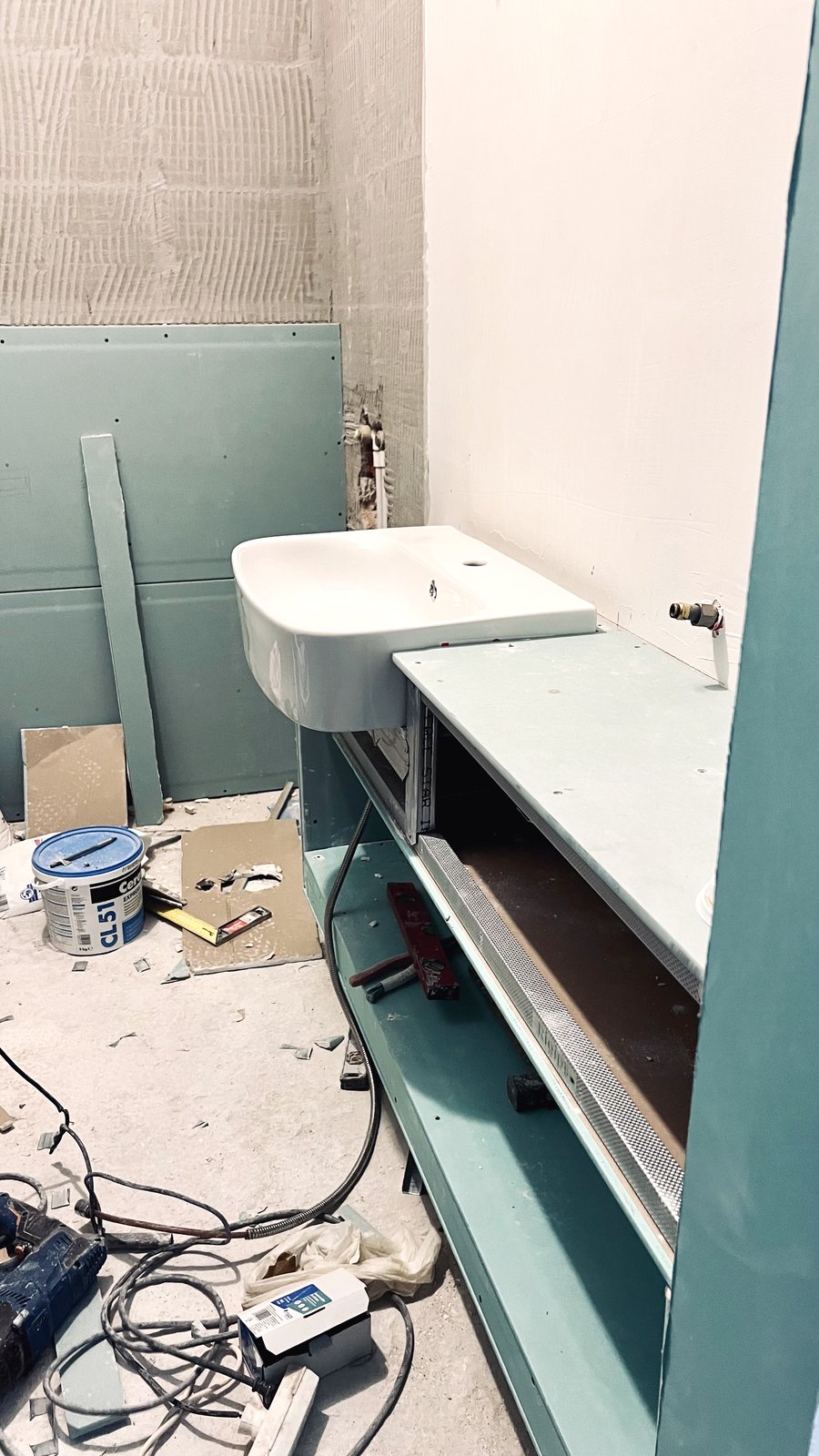 Rough plumbing and moisture board in place ahead of tiling, Studio Sakaia, Dubai