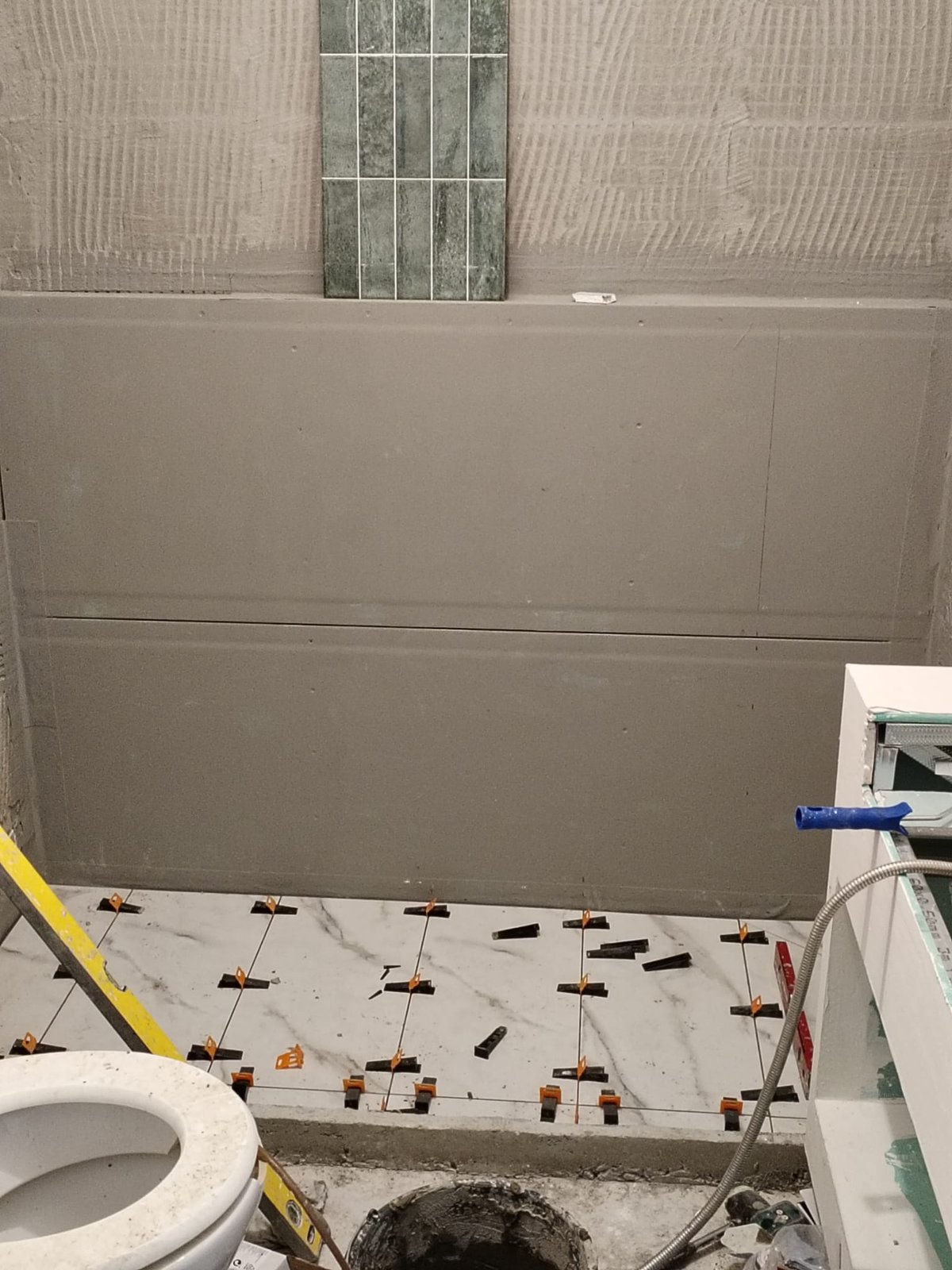 Fluted teal tile going up wall by wall, Studio Sakaia, Dubai