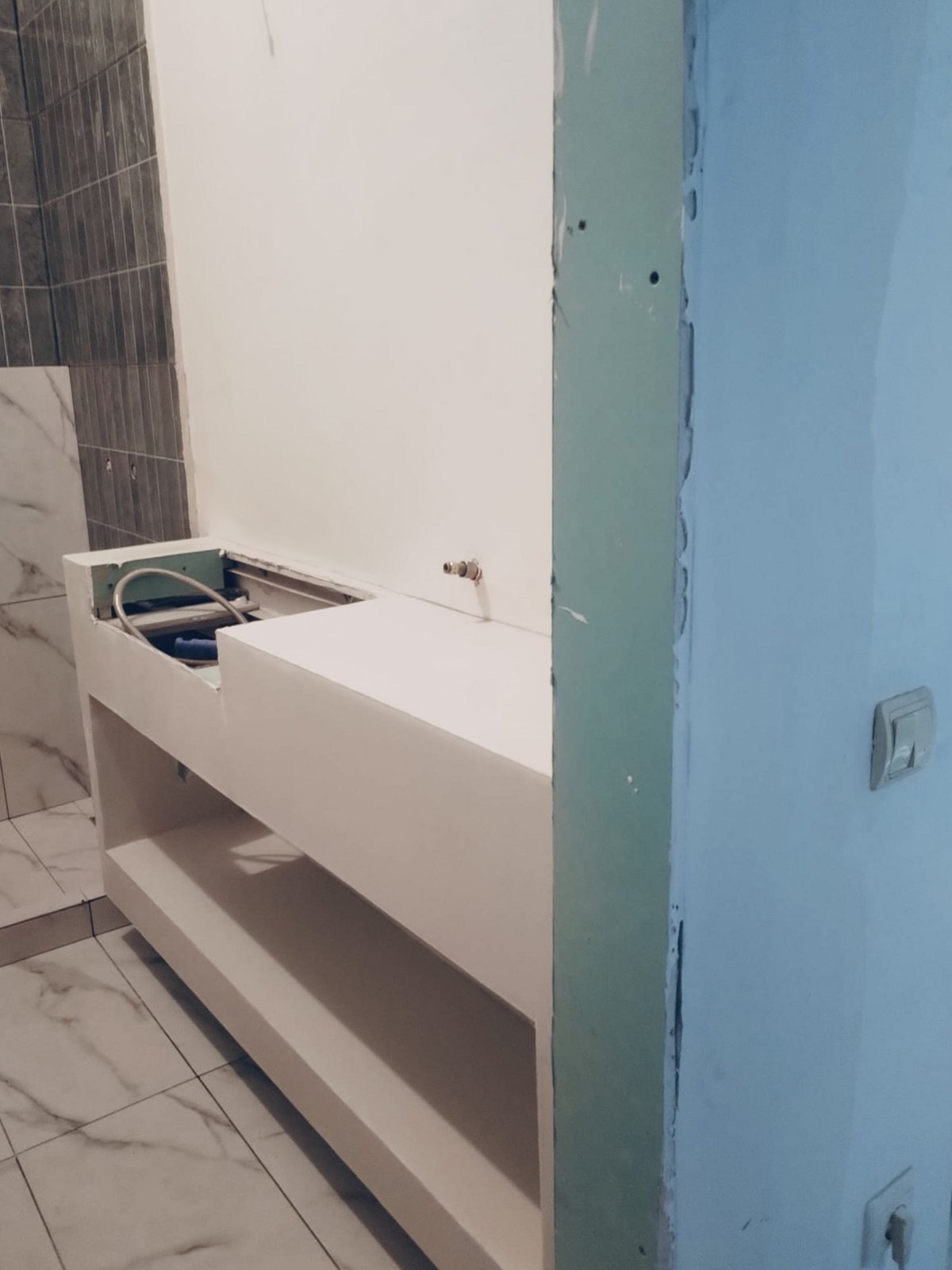 The vanity under construction against the tiled wall, Studio Sakaia, Dubai