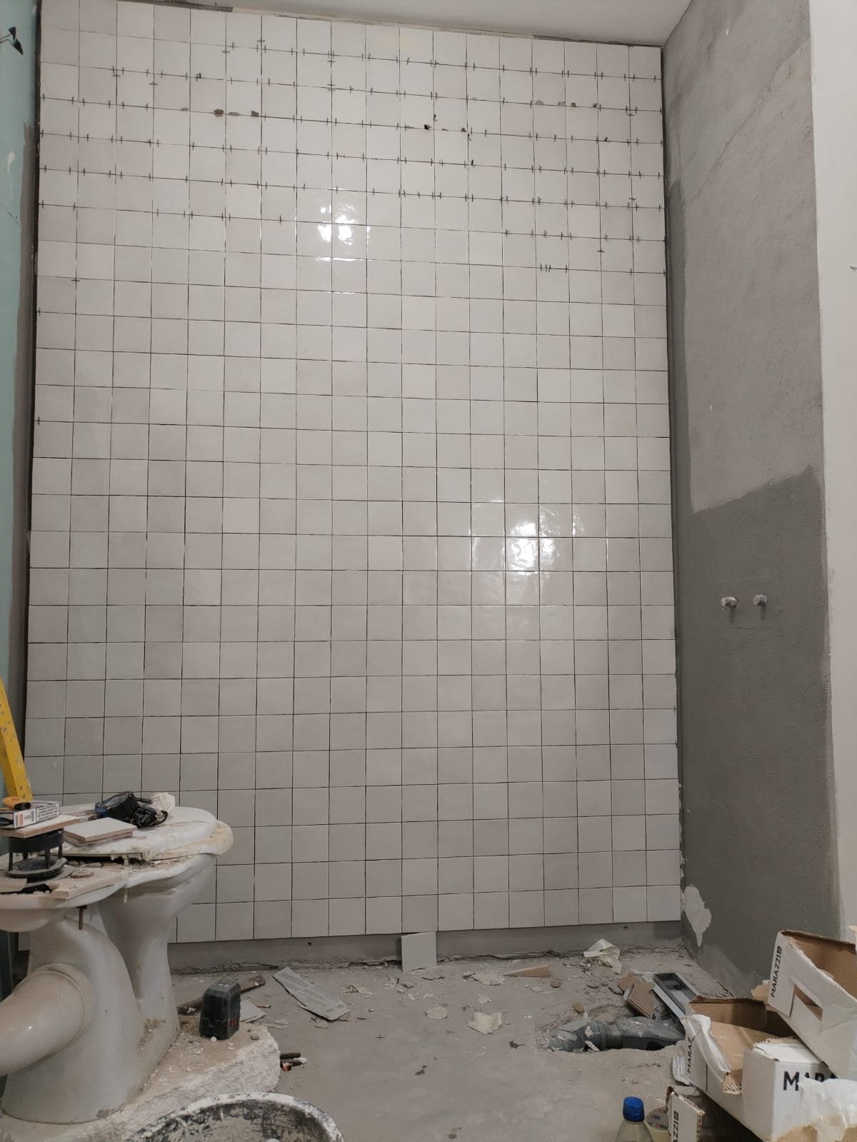 Zellige tile going up with the Marazzi boxes stacked in frame, Studio Sakaia, Dubai