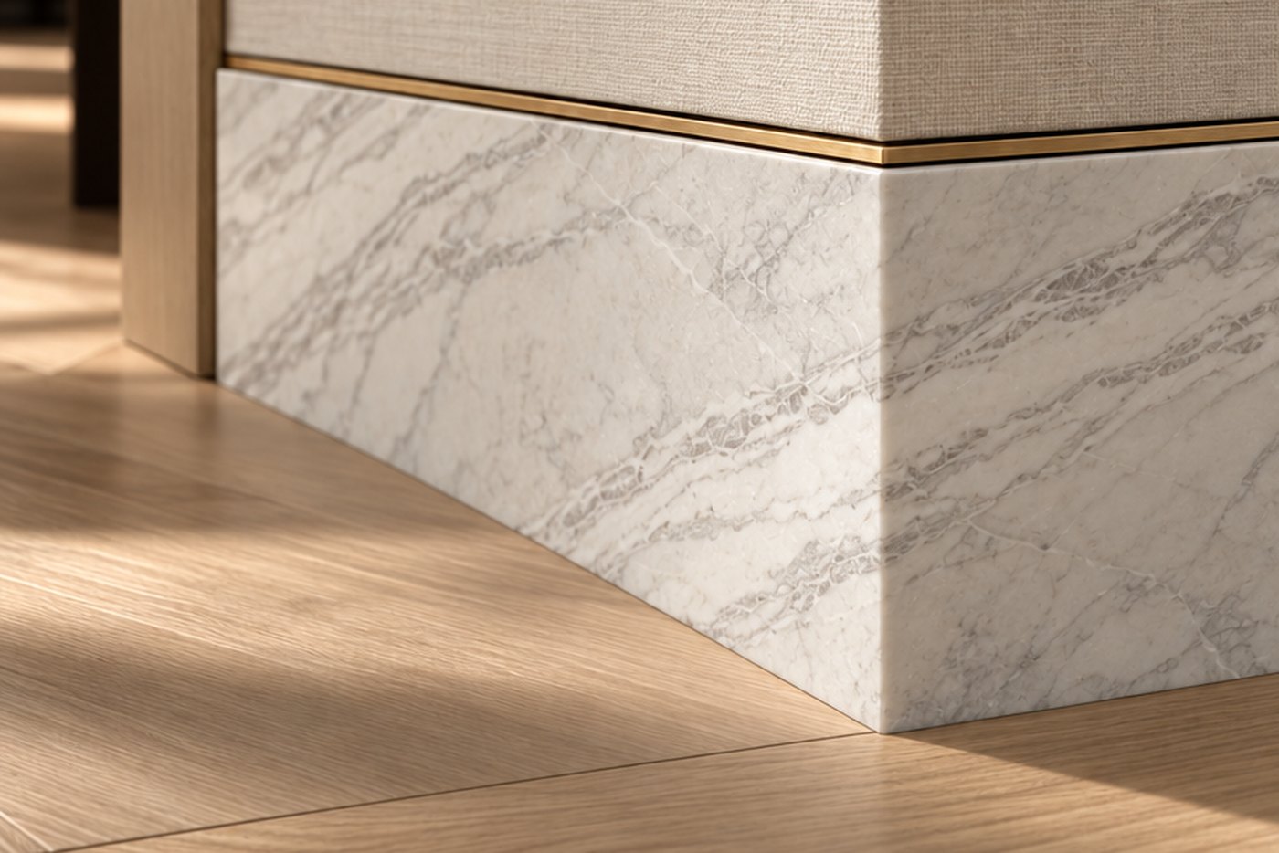 A white marble baseboard with a slim brass inlay below a linen wallcovering, on a chevron oak floor, design visualisation by Studio Sakaia.