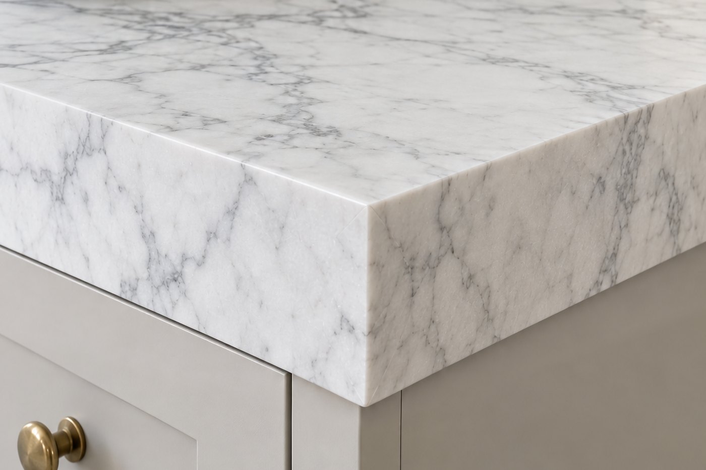 The same Calacatta countertop corner with a mitred apron edge that makes the slab read thicker, design visualisation by Studio Sakaia.