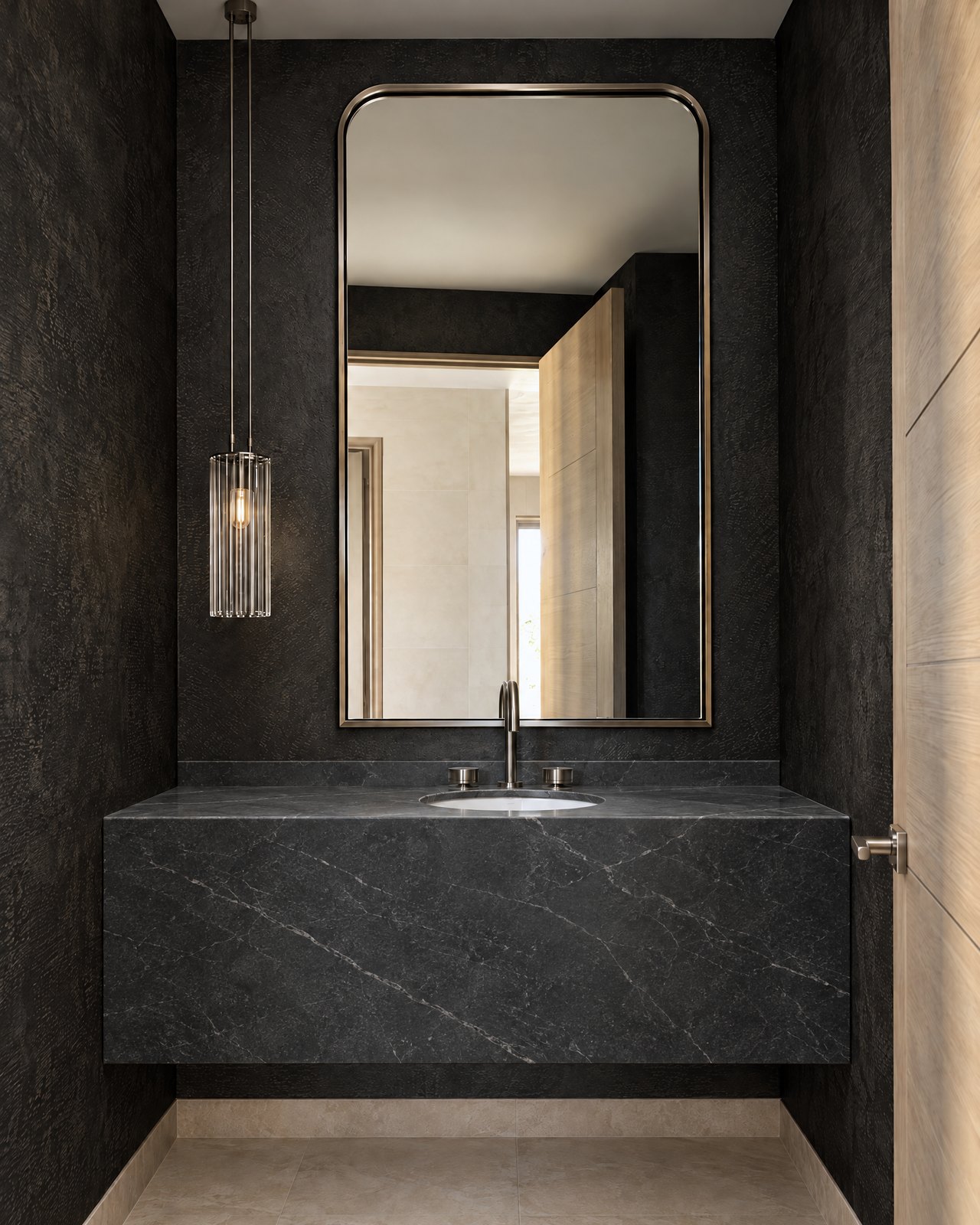 Floating vanity carved from a single block of honed soapstone in a charcoal plaster powder room, design visualisation by Studio Sakaia.