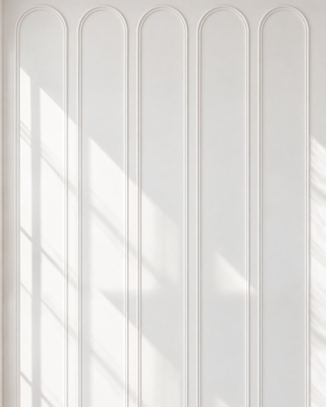 Tall arched moulding panels across a white wall above a chevron floor, design visualisation by Studio Sakaia.