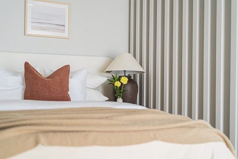 The Studio 51 bedroom, a calm Business Bay interior held in warm oak and a restrained palette, Studio Sakaia, Dubai