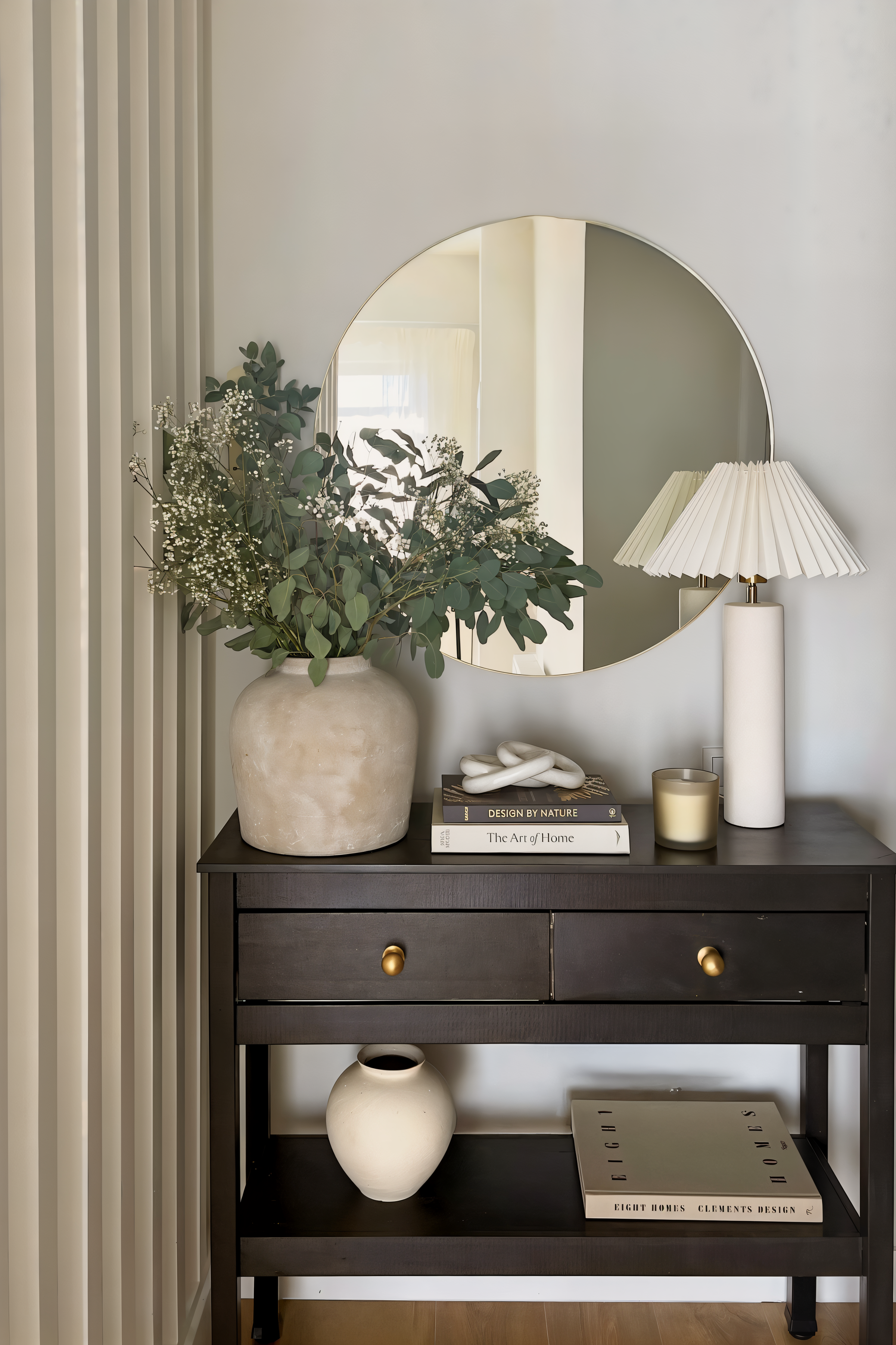 Studio 51 entrance console with a round brass mirror and reeded wall, Business Bay Dubai interior design