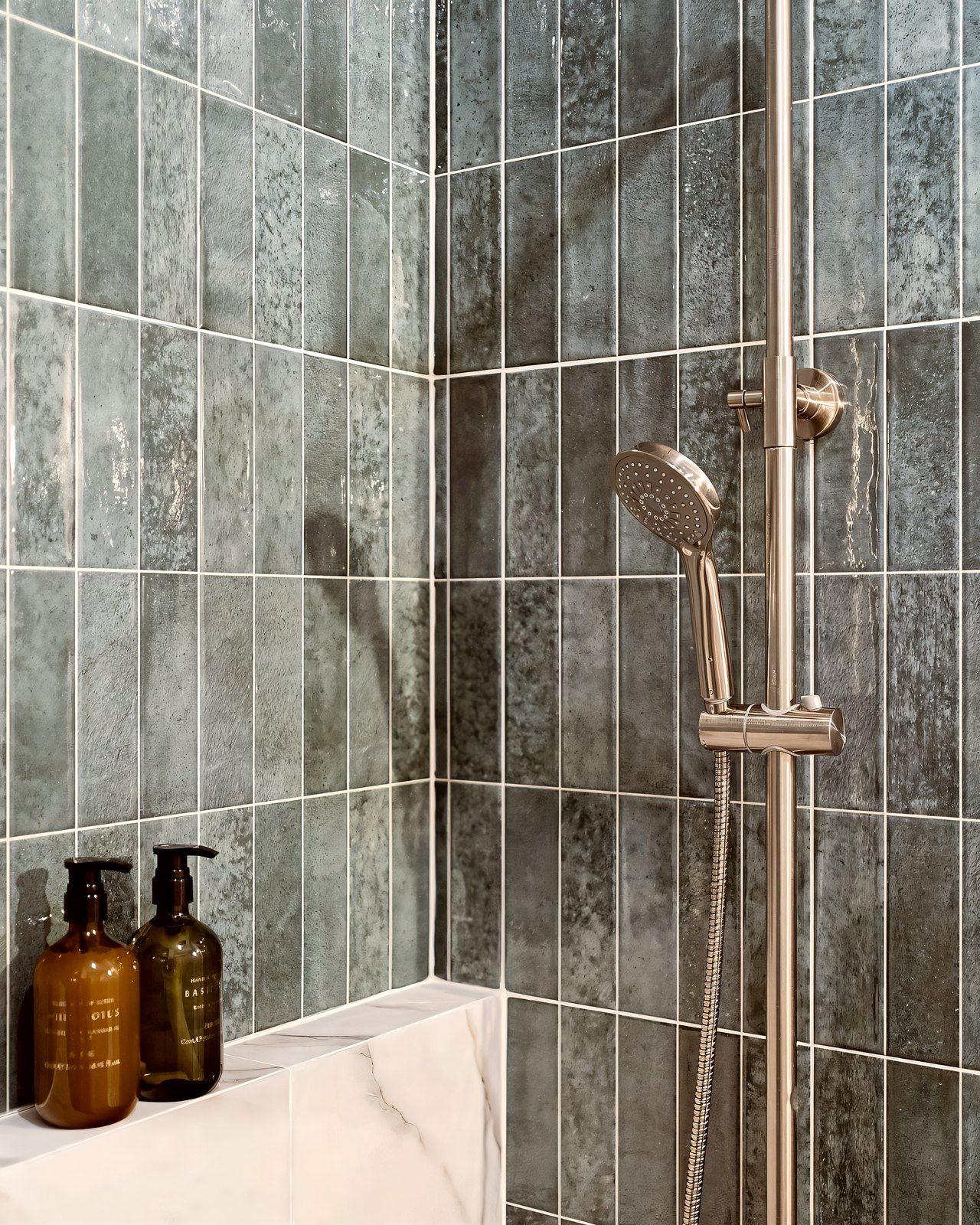 Studio 51 green zellige shower detail with a brushed fixture, Business Bay, Dubai