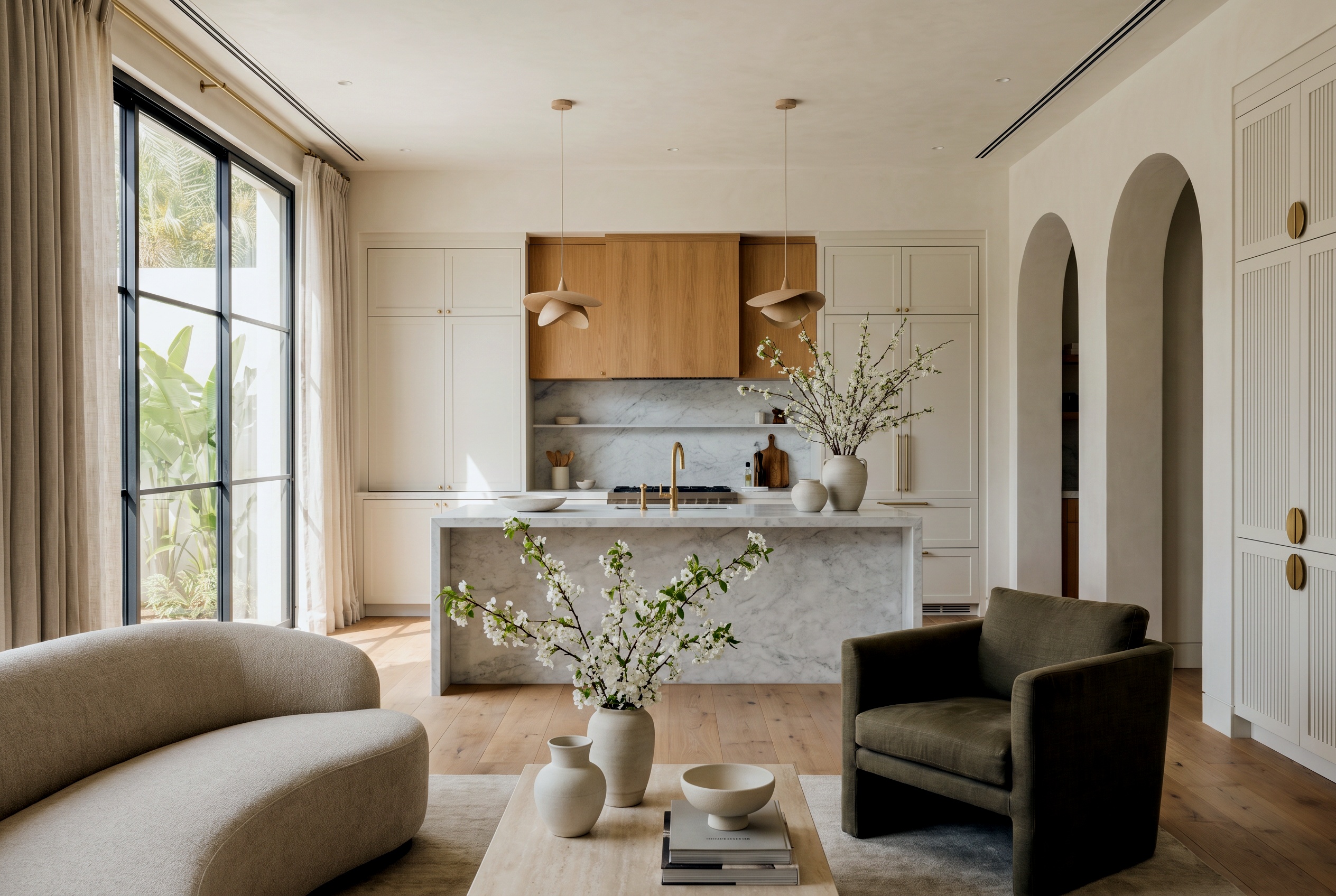 Warm modern kitchen concept with marble waterfall island and oak cabinetry, Palm Jumeirah villa renovation, Dubai